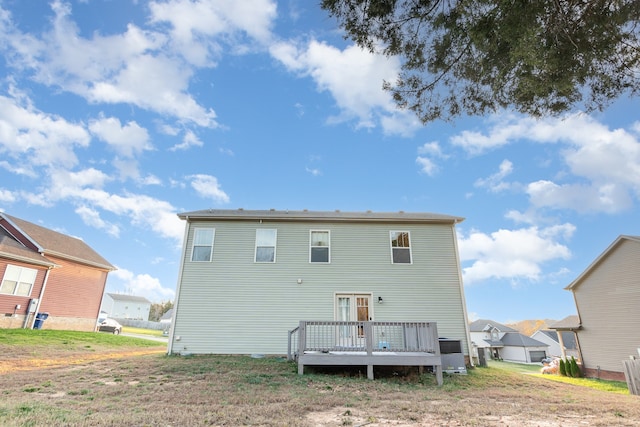 back of house featuring a wooden deck