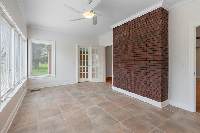 spare room featuring french doors, light tile patterned floors, ceiling fan, and ornamental molding