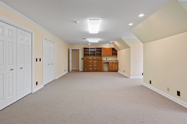 bonus room featuring light carpet and vaulted ceiling