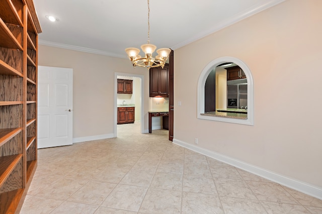 empty room with sink, an inviting chandelier, light tile patterned floors, and ornamental molding