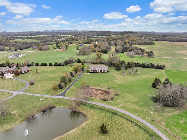 bird's eye view featuring a rural view and a water view