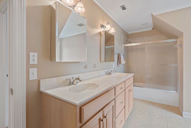 bathroom with shower / bath combination with glass door, crown molding, tile patterned flooring, and vanity