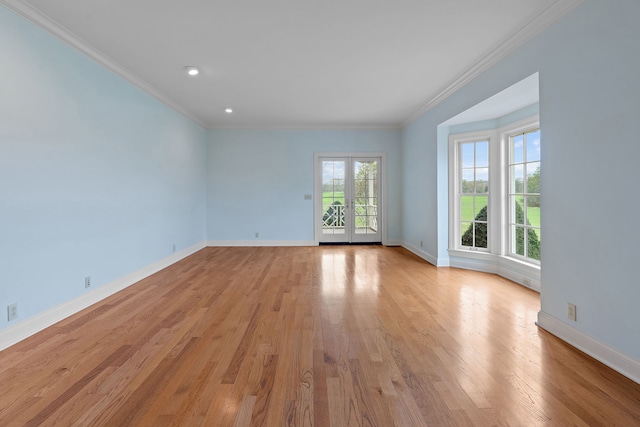 unfurnished room featuring crown molding and light hardwood / wood-style flooring