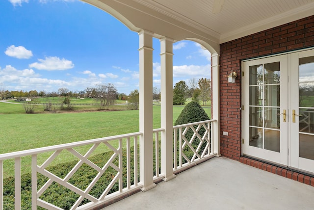 view of patio featuring french doors, a porch, and ceiling fan