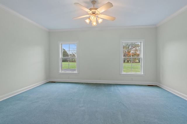 carpeted empty room featuring plenty of natural light, ceiling fan, and crown molding