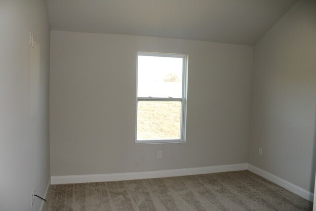 empty room featuring light carpet