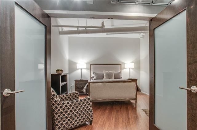 bedroom featuring hardwood / wood-style floors