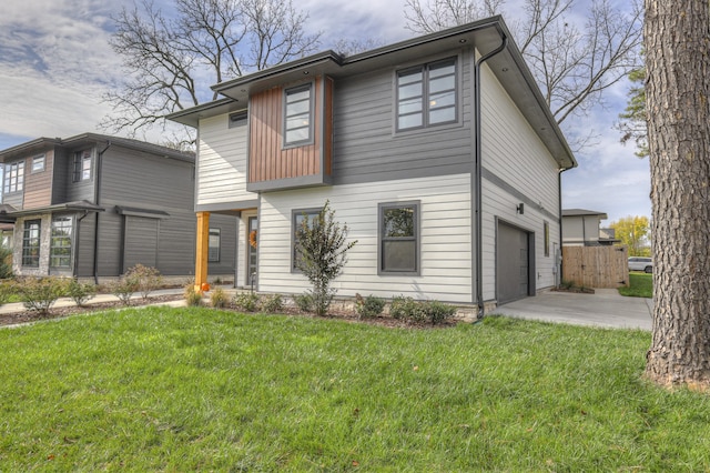 view of front of house with a garage and a front yard