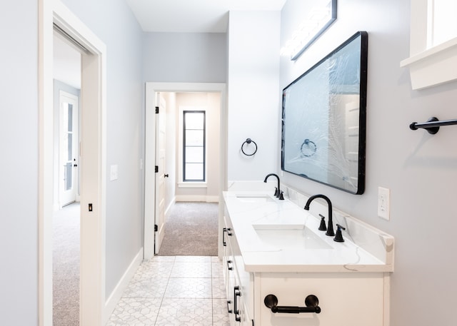 bathroom featuring tile patterned flooring and vanity