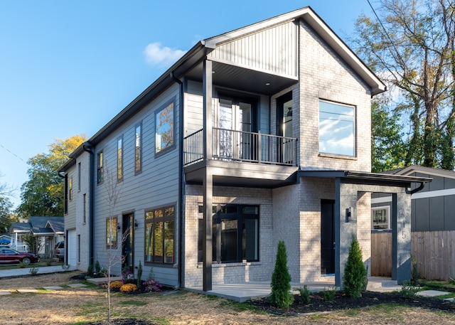 view of front of house with a balcony