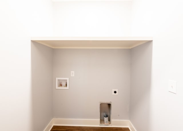 laundry room with washer hookup, dark hardwood / wood-style flooring, crown molding, and electric dryer hookup