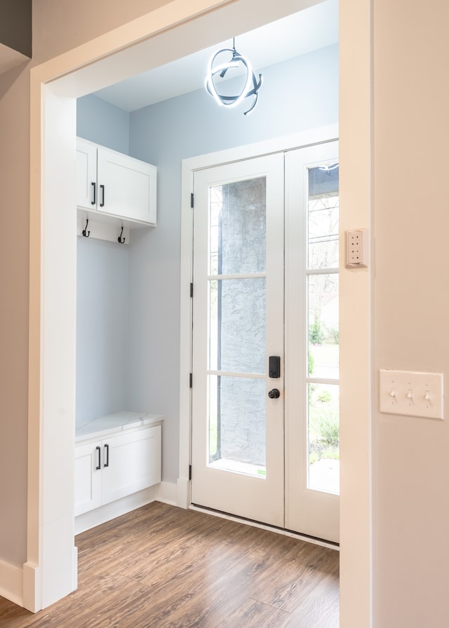 mudroom with light hardwood / wood-style flooring