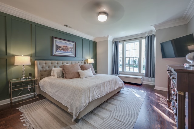 bedroom featuring ceiling fan, dark hardwood / wood-style flooring, and crown molding