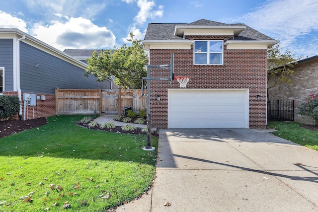 view of property featuring a garage and a front lawn