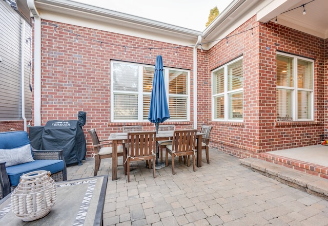 view of patio featuring a grill