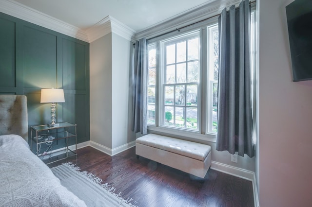 bedroom featuring crown molding and dark hardwood / wood-style floors