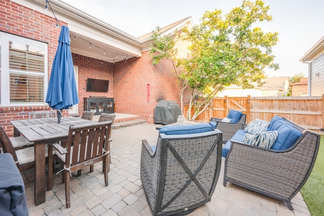 view of patio / terrace featuring an outdoor hangout area and area for grilling