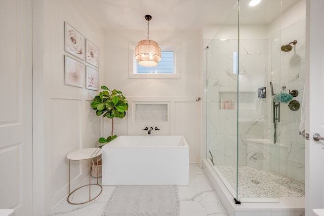 bathroom featuring independent shower and bath