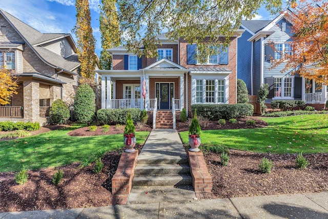 view of front of property featuring a porch and a front yard