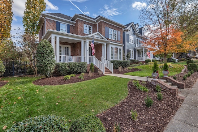 view of front of property with a front lawn and a porch