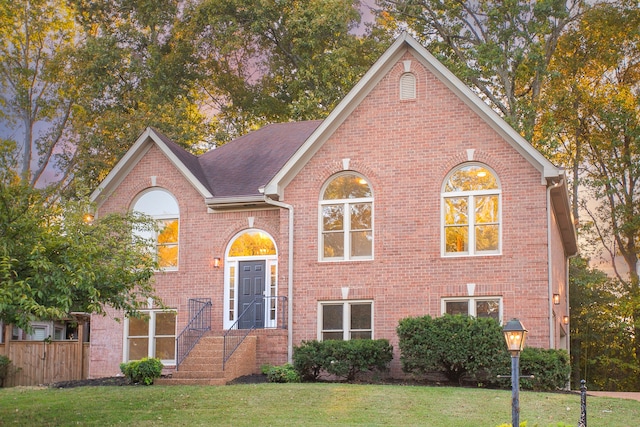 view of front of home with a front yard