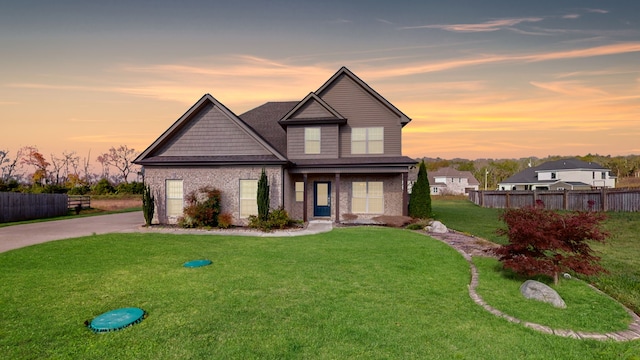 view of front of house with a yard