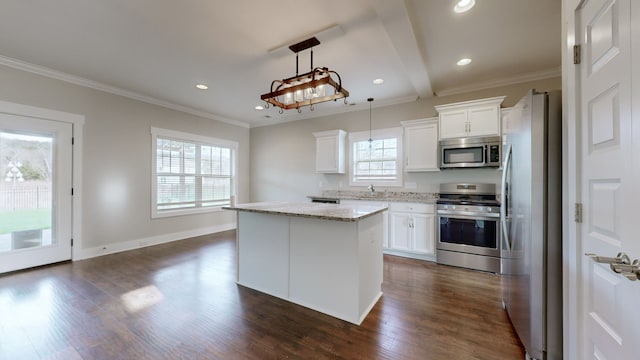 kitchen with white cabinetry, stainless steel appliances, dark hardwood / wood-style flooring, pendant lighting, and a kitchen island