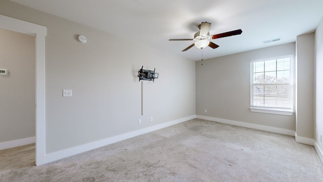 unfurnished room featuring ceiling fan and light colored carpet