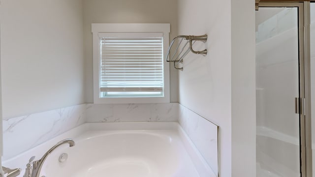 bathroom featuring a tub