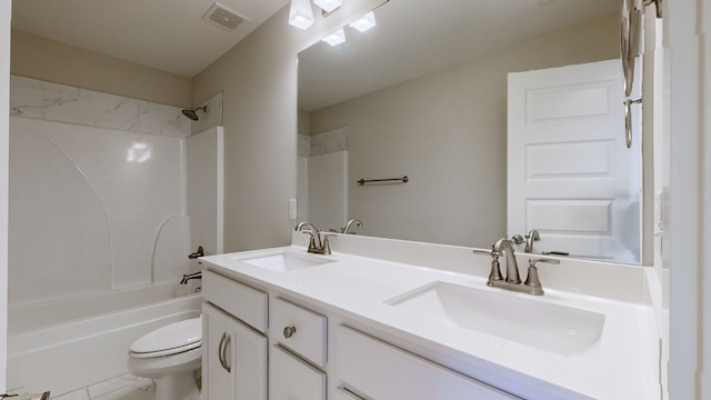 full bathroom featuring shower / washtub combination, vanity, and toilet