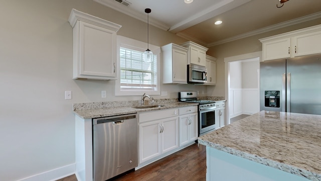 kitchen featuring light stone counters, sink, white cabinetry, and stainless steel appliances