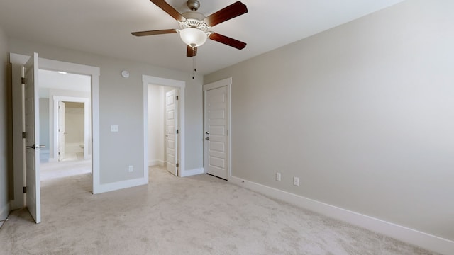 unfurnished bedroom featuring ceiling fan and light colored carpet