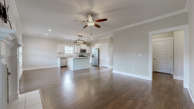 unfurnished living room with crown molding, ceiling fan, and wood-type flooring