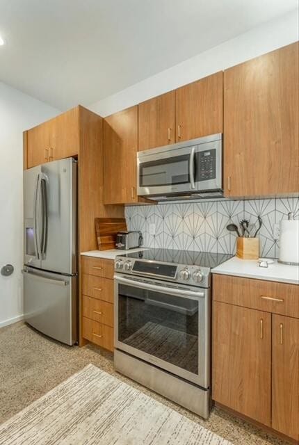 kitchen featuring backsplash and stainless steel appliances