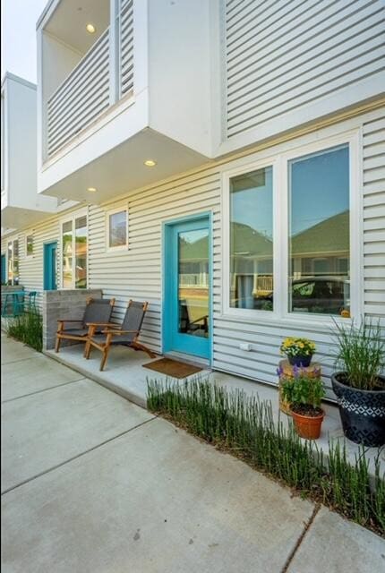 exterior space with a balcony and a patio