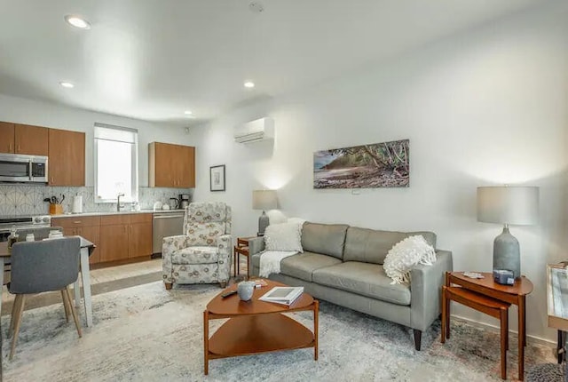 living room with a wall mounted air conditioner and sink