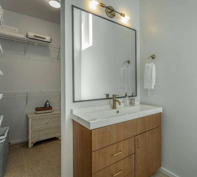 bathroom featuring tile patterned flooring and vanity