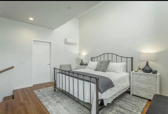 bedroom with wood-type flooring