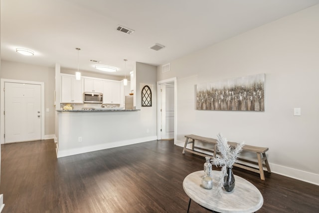 living room featuring dark hardwood / wood-style floors