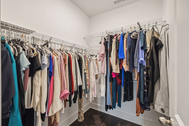 walk in closet featuring dark hardwood / wood-style flooring