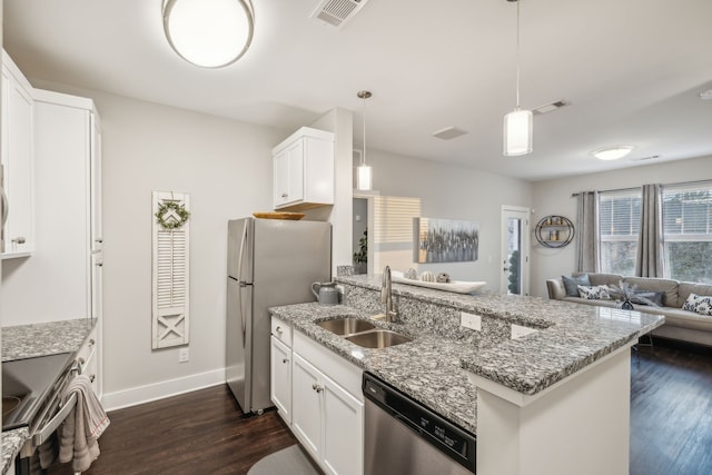 kitchen featuring dark hardwood / wood-style flooring, white cabinetry, sink, and appliances with stainless steel finishes