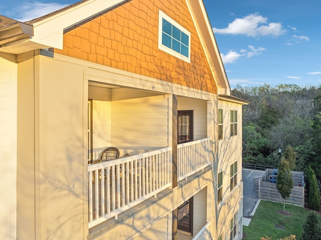 view of side of home featuring a balcony