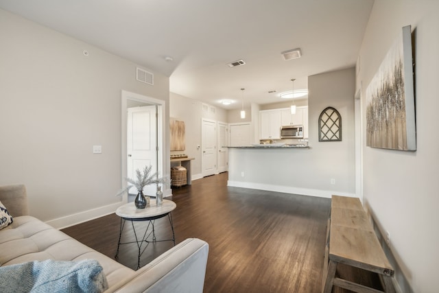 living room with dark wood-type flooring