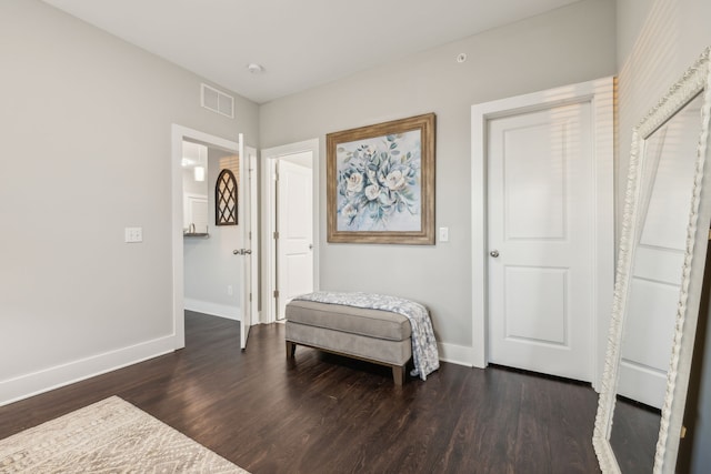 sitting room with dark hardwood / wood-style flooring