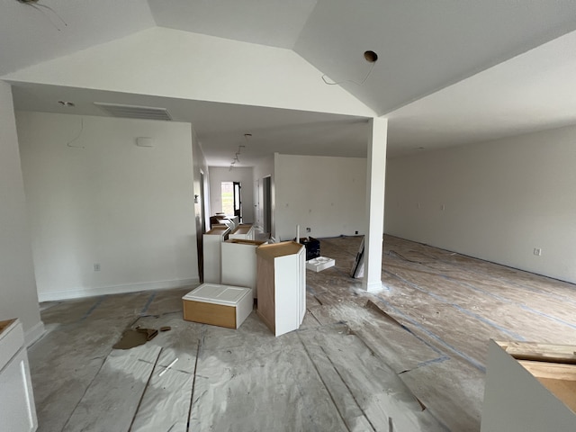 living room featuring lofted ceiling