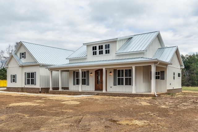 modern inspired farmhouse with covered porch