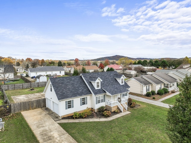 birds eye view of property featuring a mountain view