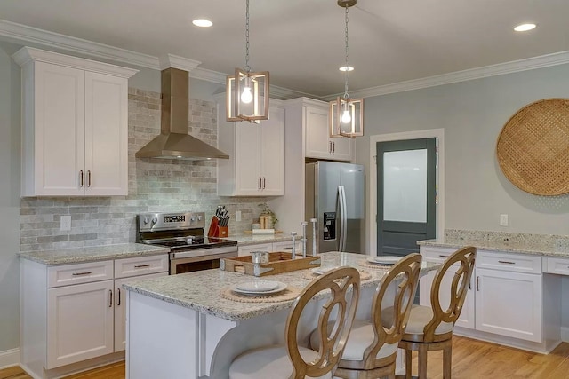 11B Double Br, Columbia, TN 38401 - kitchen with stainless steel appliances, wall chimney range hood, white cabinetry, decorative backsplash, and crown molding