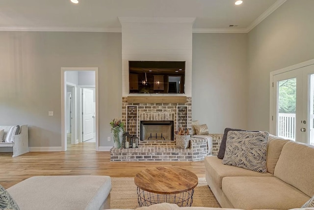 11B Double Br, Columbia, TN 38401 - living area featuring wood finished floors, crown molding, a brick fireplace, baseboards, and recessed lighting