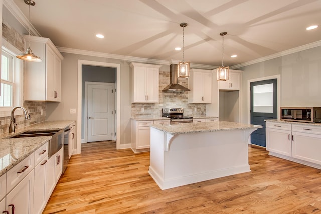 11B Double Br, Columbia, TN 38401 - kitchen featuring wall chimney exhaust hood, stainless steel appliances, backsplash, a sink, and ornamental molding